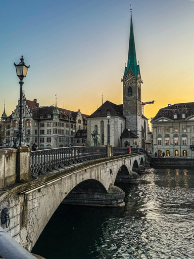 Destination Diva walking through a European canal town in a flowing dress